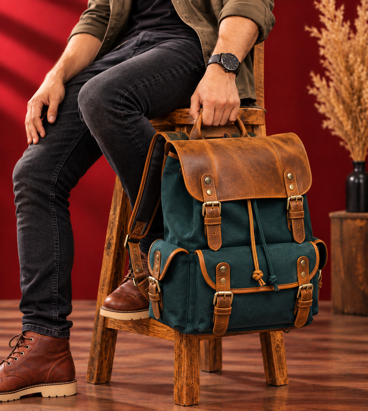 Explorer Canvas Backpack in Forest Green, carried by the top handle