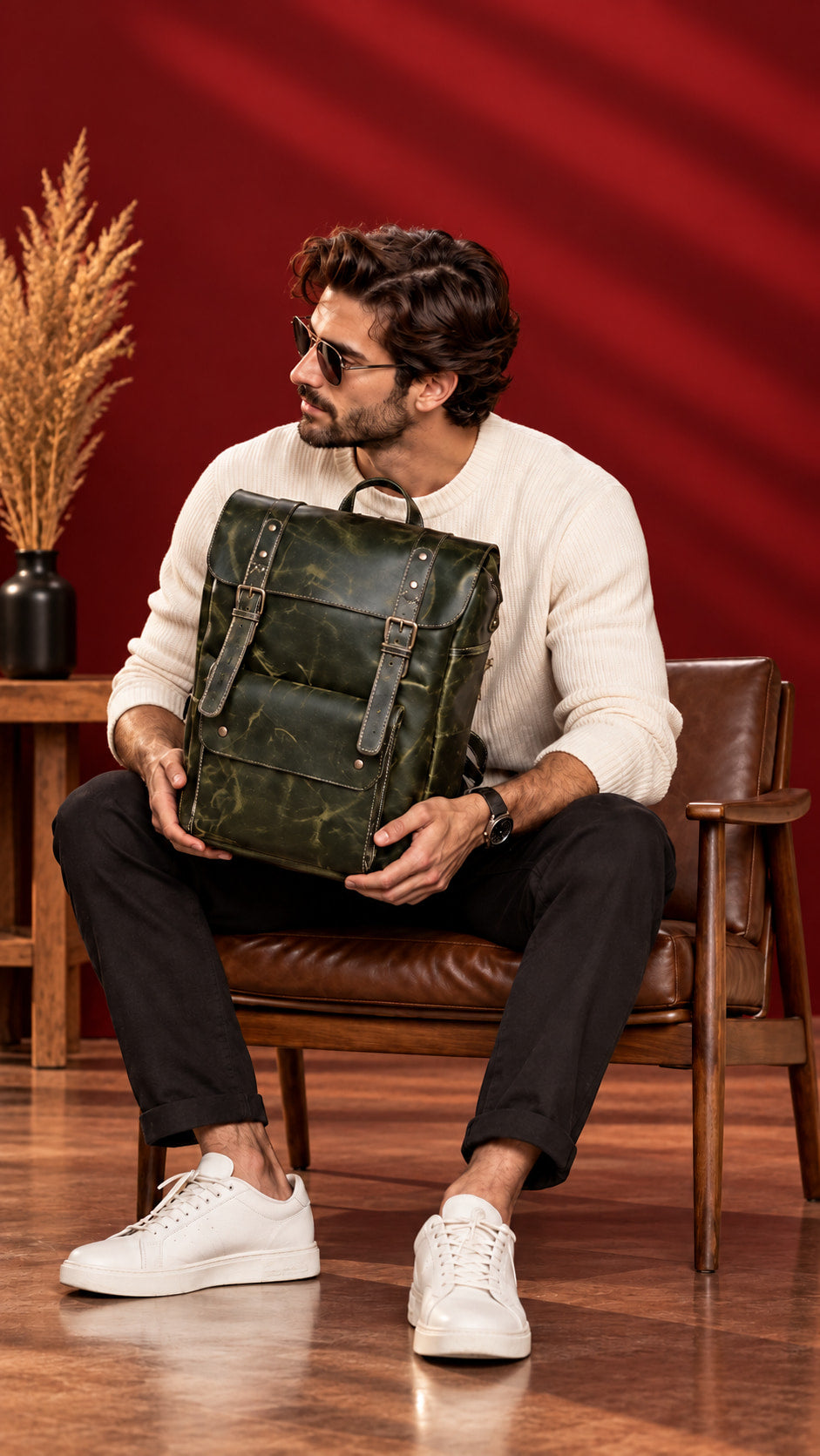 Heritage Flap Backpack in Olive Green, in hand